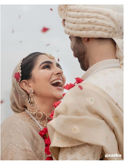 A close-up shot capturing the bride's infectious laughter, a candid moment of pure happiness.
