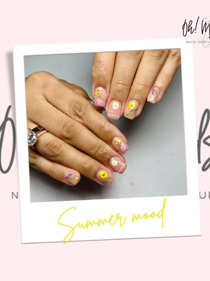Sunshine, good vibes, and the cutest summer nails. This playful design features a sheer, glittery base with hand-painted smiley faces and flowers.