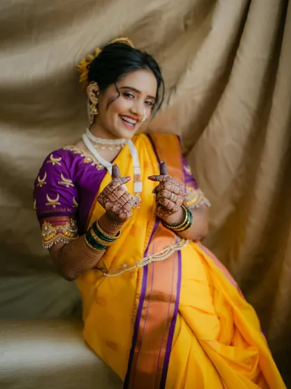 A playful and happy bride. The makeup is light and fresh, allowing her personality to shine through while still looking traditionally elegant.