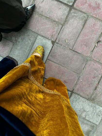 It's all in the details. The traditional jutti perfectly complements the ethnic vibe of this velvet suit.