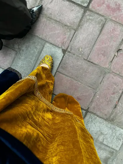 It's all in the details. The traditional jutti perfectly complements the ethnic vibe of this velvet suit.
