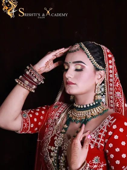 An artistic pose of a bride, showing off the stunning eye makeup and the overall grace of the North Indian bridal look.