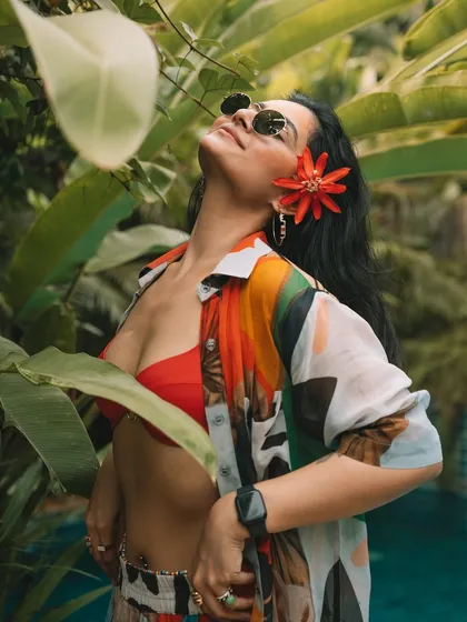 Soaking up the sun in Goa. A close-up shot with a flower in my hair, embracing the tropical paradise feel.