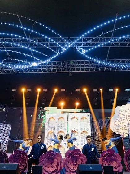 The same stage, transformed for a different performance. We used giant rose props and changed the lighting to create a completely new, romantic vibe, showcasing the versatility of our production design.
