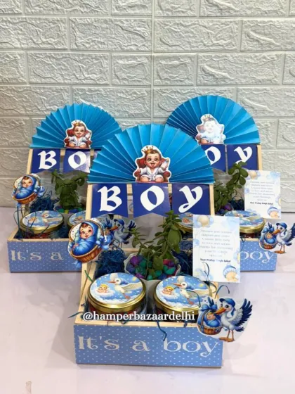 A set of three 'It's a Boy' hampers, showing consistency in quality for bulk orders.