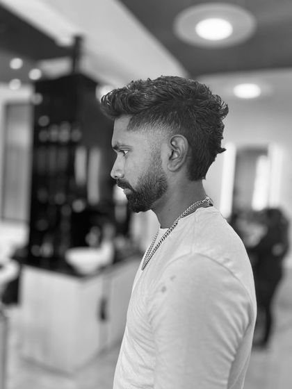 A modern mullet is all about the contrast between the short sides and the longer back. This black and white shot highlights the shape and texture of this bold haircut.