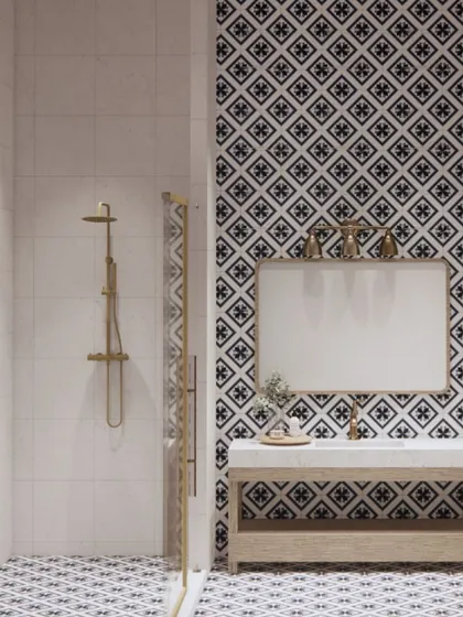 For our Goa holiday retreat project, this bathroom is inspired by the region's rich culture. The bold black-and-white patterned tiles create a graphic statement, paired with a simple wood vanity and gold fixtures.