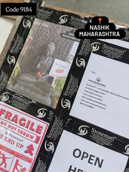 A close-up of the packing for a Buddha fountain. We even attach a photo of the product to the outside of the crate for easy identification upon arrival.