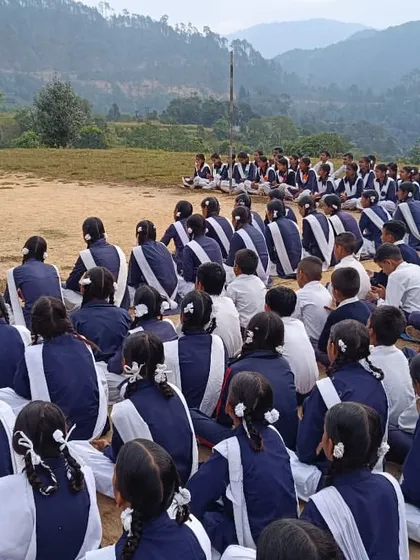 An outdoor session with students in the beautiful valleys of Uttarakhand. These workshops are a form of *nrityasewa* (service through dance), focusing on sharing knowledge rather than just performance.