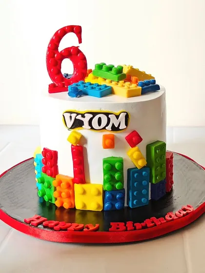 Another fun Lego cake, this time for a 6th birthday. The cake is covered in colorful edible blocks, with a big number 6 made from red fondant.