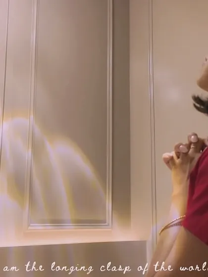 A poetic still from the 'Svarakshara' music video with the line, "I am the longing clasp of the world." This shows my love for metaphorical and soulful lyricism.