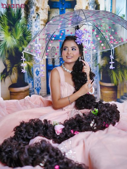 This wide shot captures the full princess gown and the river of hair, creating a truly magical image.