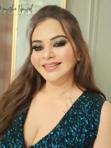 A full-face view of this party-ready look. The bold eyes are balanced with a neutral lip, keeping the focus on her stunning gaze.
