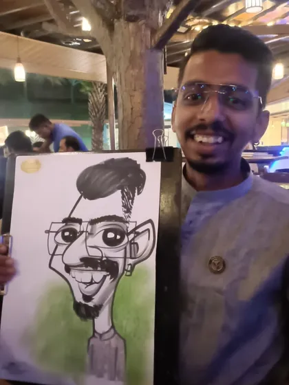 The chef from Mountain High with his caricature. It's always fun to draw the staff too.
