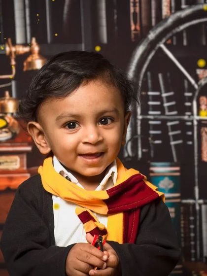 A close-up of a happy little wizard. These mini sessions are a great way to get a few magical portraits of your child in their favorite theme.