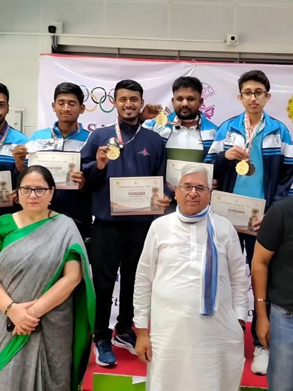 The medal ceremony at the Dasara CM Cup, with our shooters and coach recognized for their outstanding performance in the 10m rifle and pistol events.