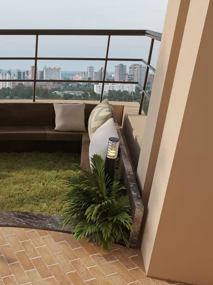 A daytime view of the corner seating nook, showing how even small spaces can be transformed into cozy green retreats.