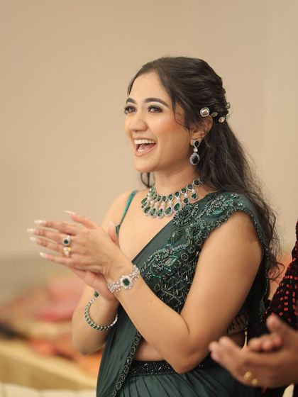 A happy, laughing client at her cocktail event. The makeup is designed to look great in every light and from every angle, capturing all the joy of the moment.
