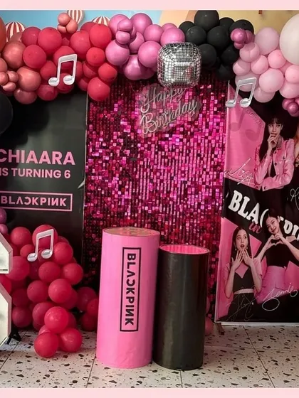 A full view of the stunning Blackpink birthday setup for Chiaara, featuring a light-up number '6' and custom-branded pedestals for the cake.
