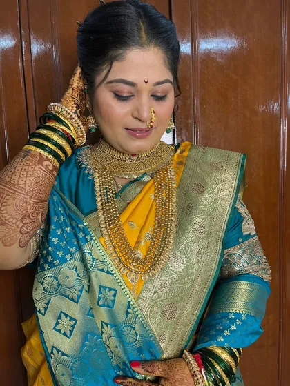 My bride Namrata, looking like a queen on her wedding day in a stunning yellow and teal saree.