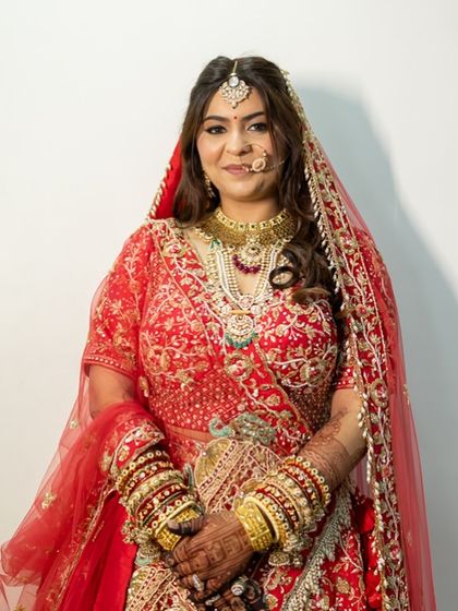 A beautiful portrait of the bride, ready for her wedding. The makeup is flawless and enhances her features perfectly.