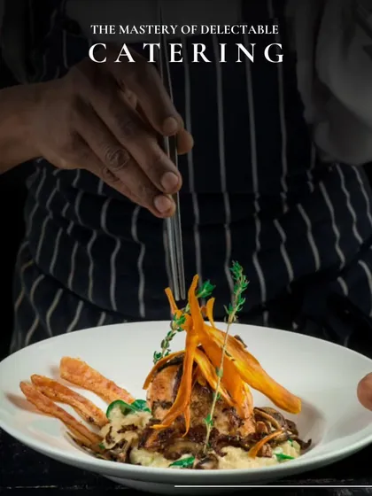 The mastery of delectable catering. A chef artfully plates a gourmet dish, showcasing the skill and precision that goes into every culinary creation we serve.
