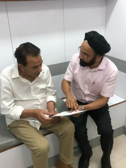 Here I am discussing a treatment plan with the late Shri Dharmendra Ji. These moments of personal interaction and trust are at the heart of our practice.