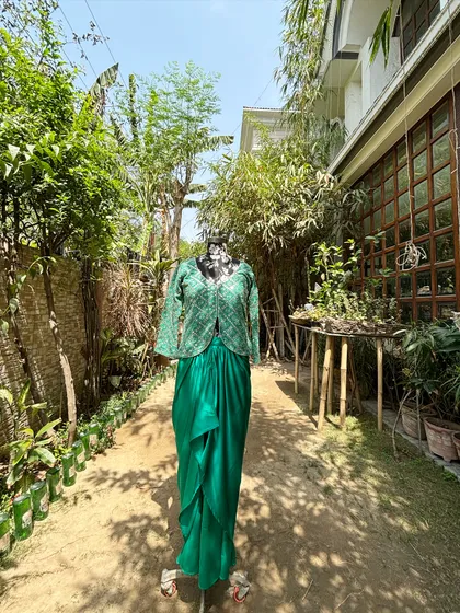 The full view of the green jacket set in our garden. The color is perfect for a mehendi or a day wedding.