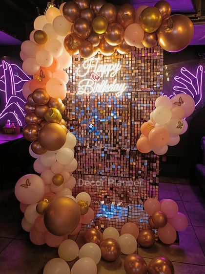 This image captures the beautiful texture of the balloon garland, with varying sizes and shades of pink, white, and rose gold. It’s a testament to how thoughtful arrangement can elevate a design.