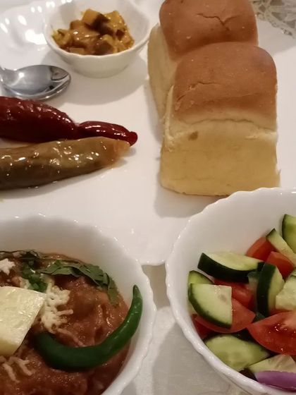 Another angle of the delicious pav bhaji meal. A good pickle can elevate even the simplest of dishes.