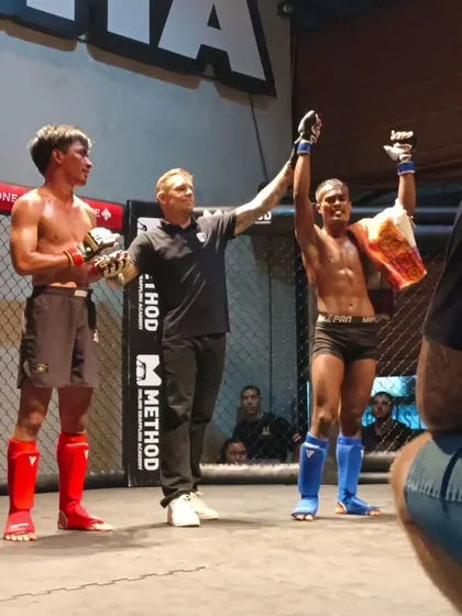 The moment every fighter works for. Our student's hand is raised in victory after a tough MMA fight at Canggu Fight Night in Bali, Indonesia. This is the result of countless hours of dedication, sweat, and never giving up.