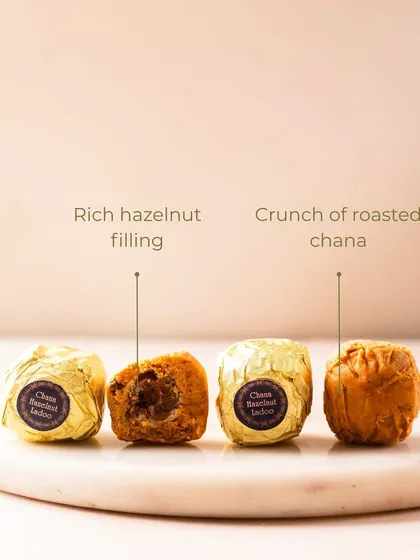 A cross-section of my Chana Hazelnut Ladoo reveals its secret: a rich hazelnut filling surrounded by the crunch of roasted chana. A truly unique indulgence.