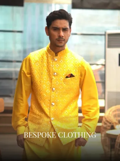 A vibrant yellow waistcoat with all-over mirror work and embroidery, layered over a matching yellow kurta. A regal and festive look, rooted in tradition but styled for today.