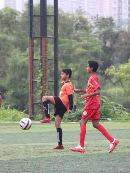 Players in action during a U13 match at the Grassroots Football Fiesta.