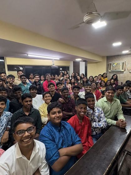 A wide shot of our classroom filled with students during the Satyanarayan Pooja. The entire Divesh Classes family comes together to seek blessings for the year ahead.