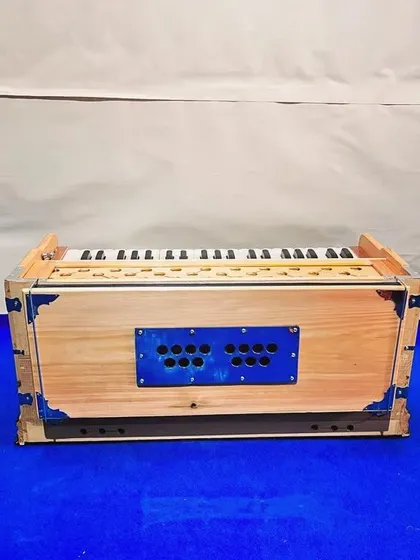 This image shows the compact profile of our standard 9-stopper harmonium. We ensure every instrument has a smooth bellows action and responsive keys before it reaches you.