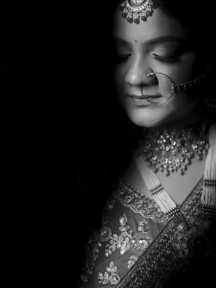 The black and white version of the intense bridal portrait, which enhances the mood and focuses on the play of light and shadow.