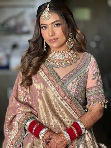 A classic half-up style with soft, flowing waves is one of my most requested looks. It’s timeless, romantic, and perfect for any wedding event, from the engagement to the reception.