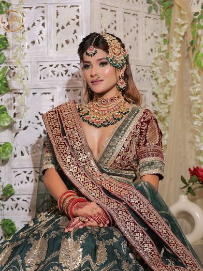 A set of three images of a bride in a green and maroon velvet lehenga. These shots capture the regal essence and are perfect for a traditional bridal lookbook.