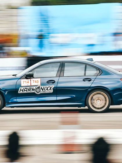 Another action shot of the blue Harmonixx-branded BMW, showcasing its performance on the track. We ensure our partners are seen where it matters most: in the heart of the action.