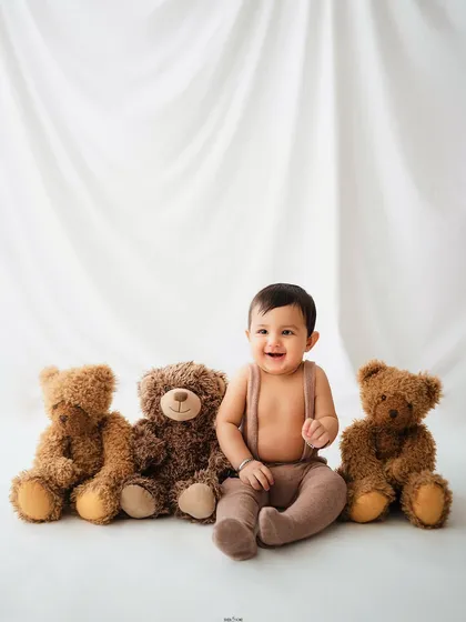A classic baby portrait with a lineup of his three best teddy bear friends.