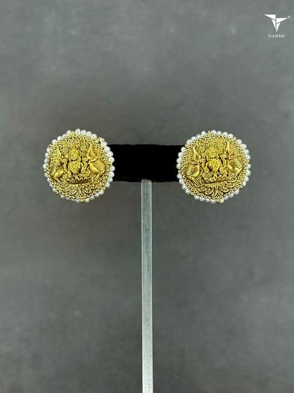 A different view of my classic Maa Laxmi 22kt gold earrings, showcasing the fine detail and the beautiful pearl border. A true piece of heritage jewellery.