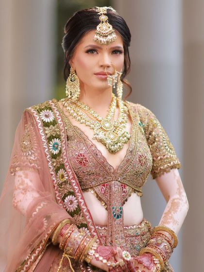 A regal portrait of our beautiful bride. The makeup is flawless, enhancing her features and celebrating her unique skin.