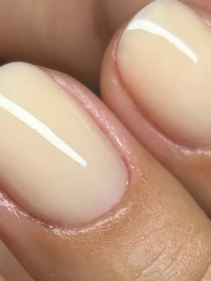 The perfect Russian Manicure. Notice the incredibly clean cuticle line and the smooth, flawless application of this jelly nude gel polish. This meticulous technique ensures your manicure not only looks perfect but also lasts longer.