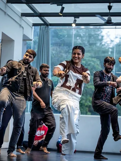 The energy in this shot is contagious. This is a Hip-Hop Bhangra routine, a fusion style I love to teach. It combines the swag of hip-hop with the powerful beats of Bhangra, making for an incredible workout.