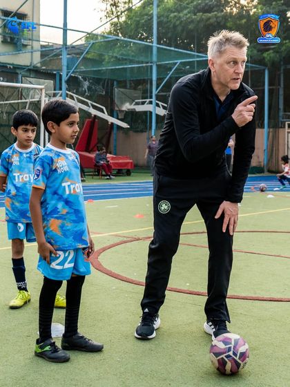Pointing the way forward. Heimir instructs young players on positioning and movement, key elements of the tactical understanding we build at SFL.