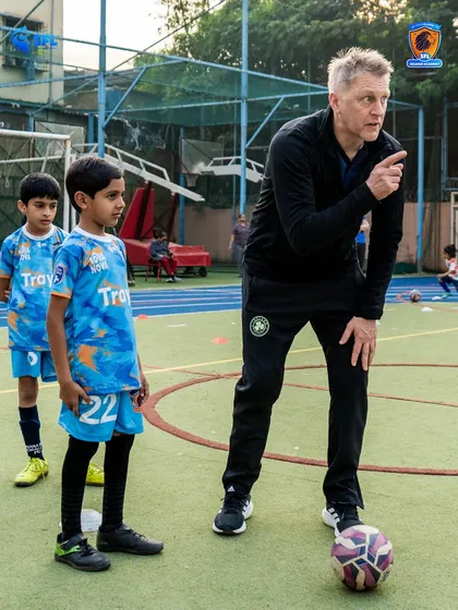 Pointing the way forward. Heimir instructs young players on positioning and movement, key elements of the tactical understanding we build at SFL.