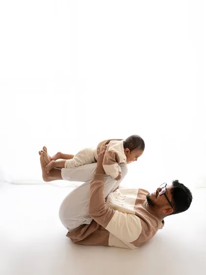 Playtime with dad! These fun, interactive shots are just as important as the formal portraits for showing a family's true personality.