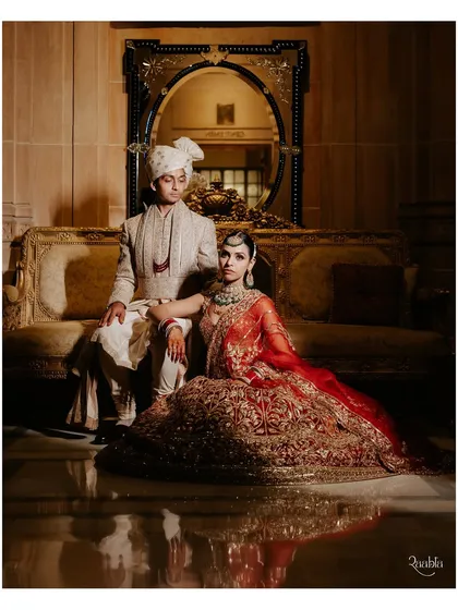A regal portrait of a bride and groom at the Umaid Bhawan Palace. We work with your photography team to identify the most iconic spots within these grand venues for timeless wedding portraits.