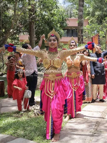 A traditional 'Bhaat' or 'Mayra' function entry. I use dancers in vibrant, traditional costumes to make even the more intimate family ceremonies feel grand and celebratory.